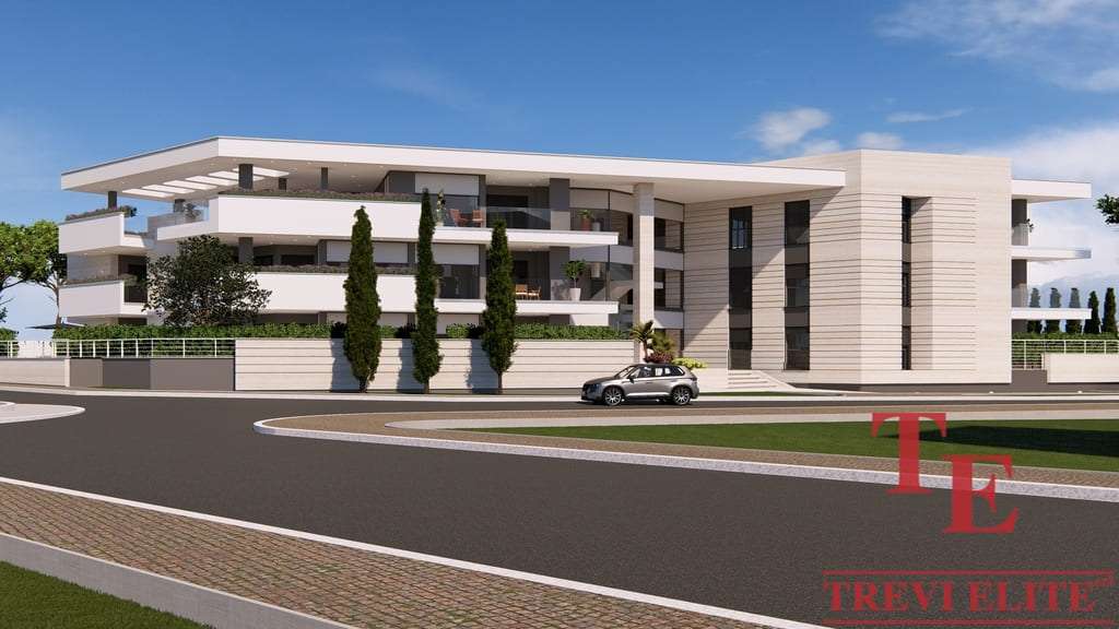 Эксклюзивное современное здание роскошной недвижимости в Италии, окруженное аккуратным ландшафтом и уютной зоной отдыха, предлагающее комфорт и престиж.