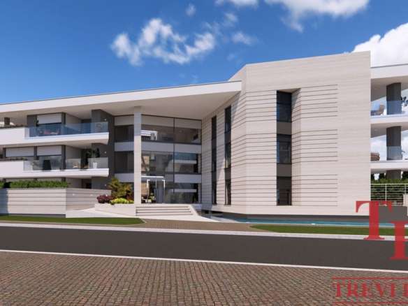 Высококлассное жилое здание современного дизайна, окруженное зеленью и дорожной инфраструктурой, представляет элитную недвижимость в Италии и по всему миру от агентства Треви Элит.