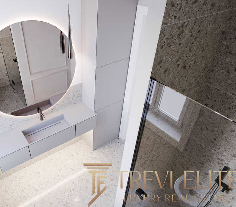 Современный интерьер ванной комнаты с просторной раковиной и круглыми зеркалами, выполненный в светлых оттенках, идеально подходит для элитного жилья.