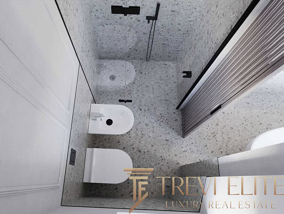 Современная ванная комната с роскошной отделкой и сантехникой, отличное решение для комфортной жизни в элитной недвижимости.