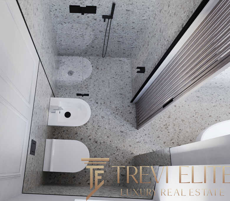 Современная ванная комната с роскошной отделкой и сантехникой, отличное решение для комфортной жизни в элитной недвижимости.