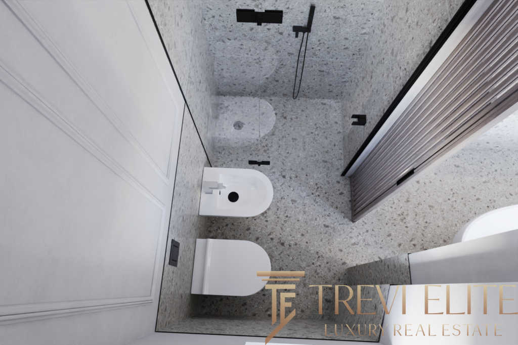 Современная ванная комната с роскошной отделкой и сантехникой, отличное решение для комфортной жизни в элитной недвижимости.