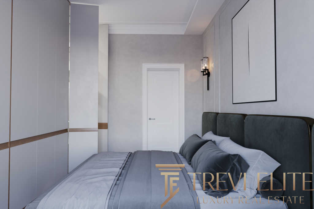 Современная спальня с мягкой кроватью, стильным дизайном, встроенными шкафами и оригинальным освещением для комфортного отдыха.