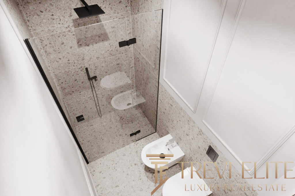 Современная ванная комната с душевой кабиной и туалетом в элитной недвижимости. Элегантное оформление, высококачественные материалы, стильный дизайн для комфорта и уюта.