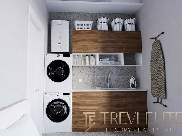 Беспроигрышное решение для дома: автоматическая стиральная машина и сушилка на фоне компактной кухни с деревянными фасадами и удобным хранением. Современный дизайн и функциональность в одном помещении.