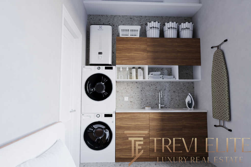 Беспроигрышное решение для дома: автоматическая стиральная машина и сушилка на фоне компактной кухни с деревянными фасадами и удобным хранением. Современный дизайн и функциональность в одном помещении.