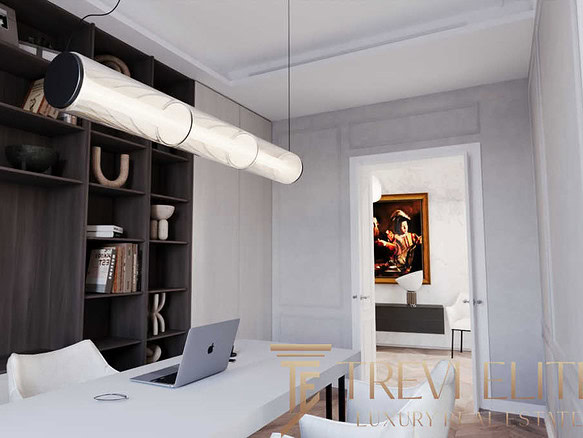 Современный домашний офис с компьютерным столом, стильными книгами и декоративными элементами. Отличное пространство для работы и творчества в элитной недвижимости.