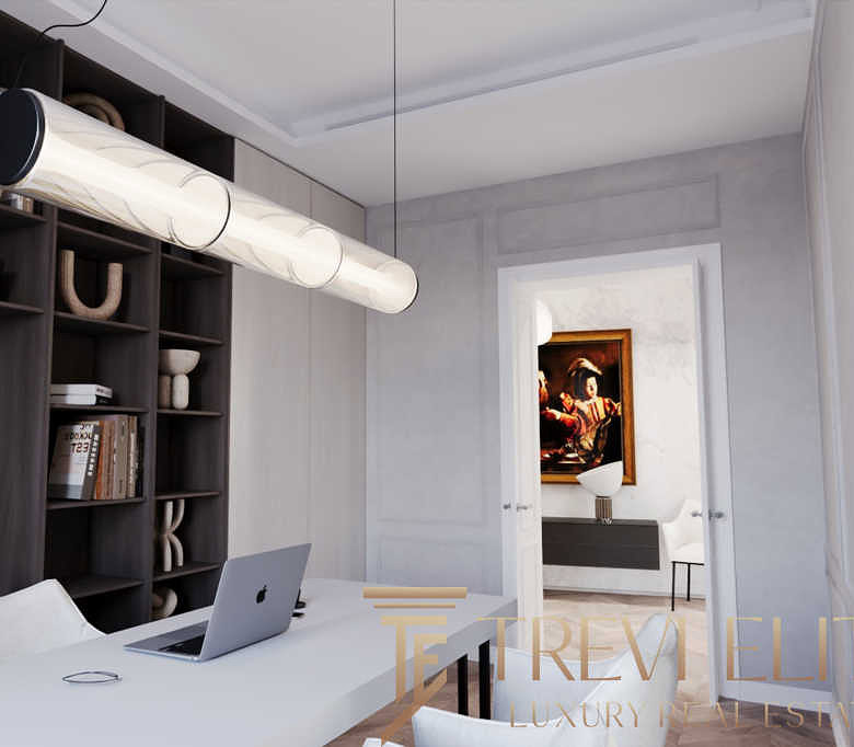 Современный домашний офис с компьютерным столом, стильными книгами и декоративными элементами. Отличное пространство для работы и творчества в элитной недвижимости.