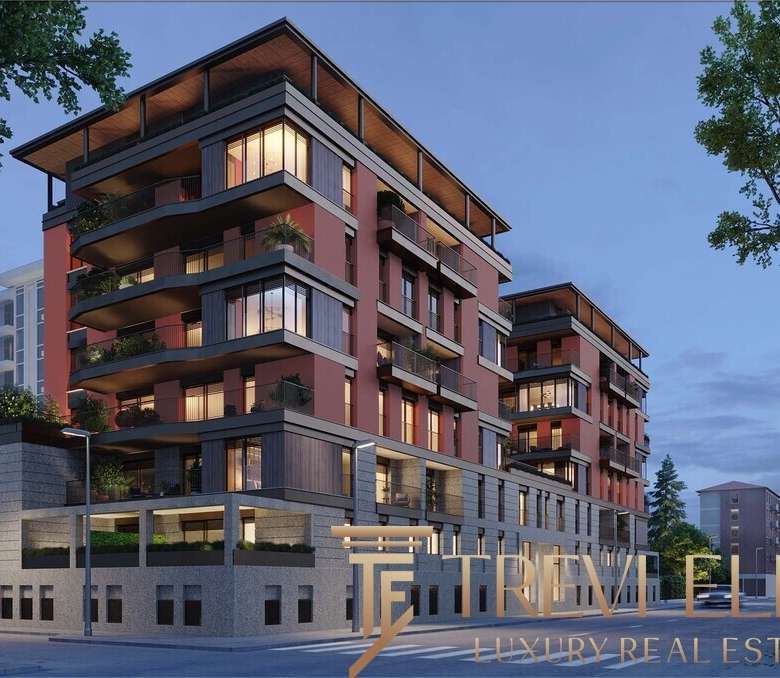 Высококлассный жилой комплекс с современным дизайном, панорамными окнами и просторными балконами, расположенный в престижном районе для элитной недвижимости.