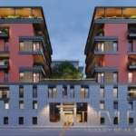 Современное элитное жилое здание с панорамными окнами и зелеными террасами, предназначенное для роскошной жизни и инвестиций, входящее в эксклюзивное портфолио агентства Треви Элит.