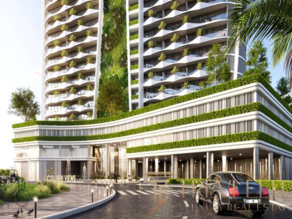 Современный жилой комплекс с зелеными террасами и уютными балконами, роскошное здание в центре города с дизайнерским фасадом и благоустроенной территорией, эксклюзивное жилье высокого класса.