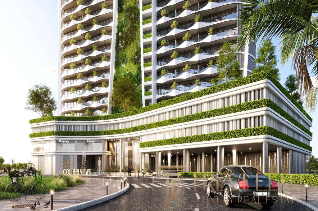 Современный жилой комплекс с зелеными террасами и уютными балконами, роскошное здание в центре города с дизайнерским фасадом и благоустроенной территорией, эксклюзивное жилье высокого класса.