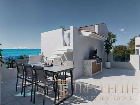 Современная терраса на берегу моря с видом на океан, стильное зонирование, уличная мебель и барбекю, идеальное место для отдыха и развлечений.