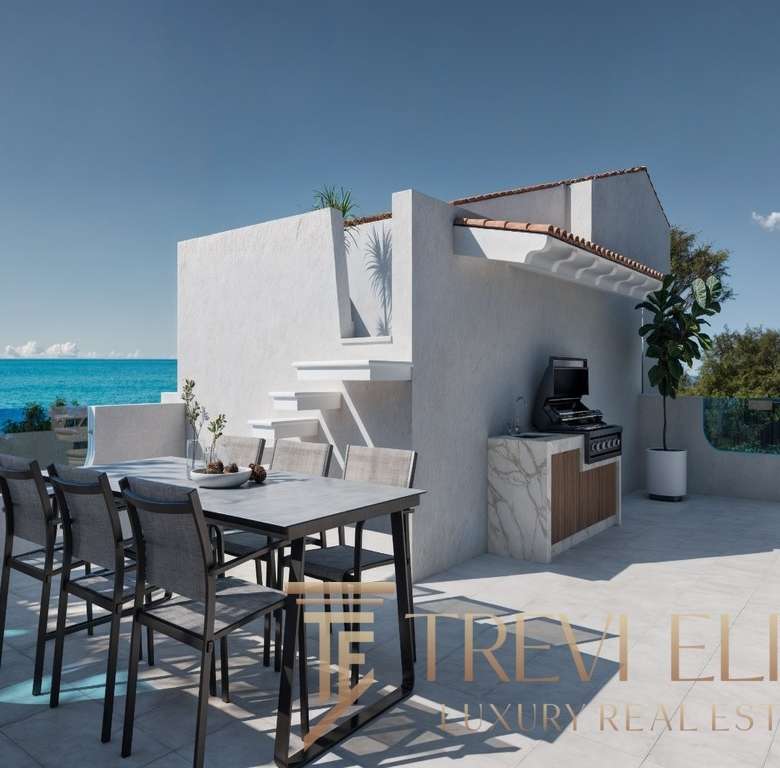 Современная терраса на берегу моря с видом на океан, стильное зонирование, уличная мебель и барбекю, идеальное место для отдыха и развлечений.