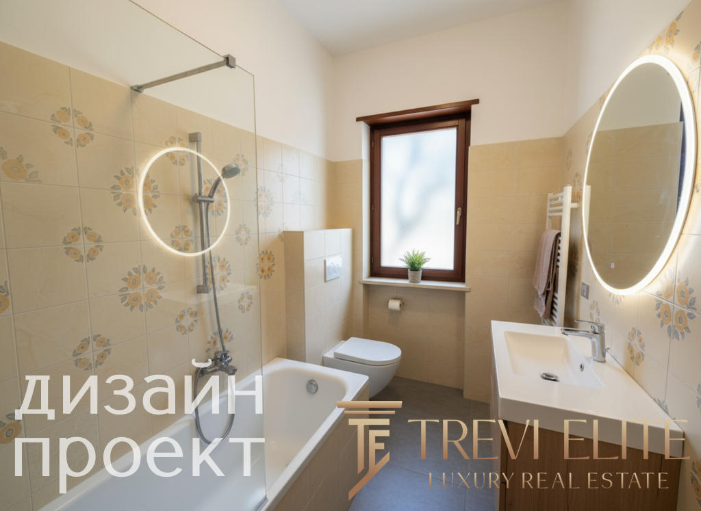 Современная ванная комната с аккуратным дизайном, встроенной раковиной, зеркалом с подсветкой и теплым светлым интерьером, создающим уют и комфорт.