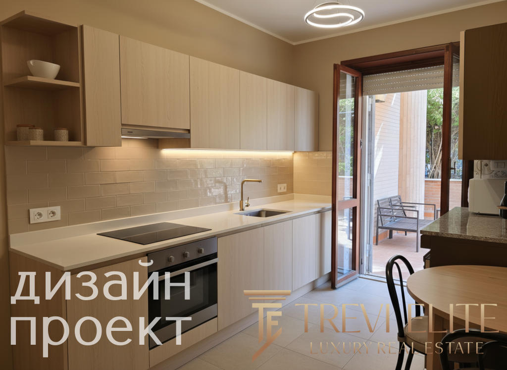 Современная кухня с белыми фасадами и встроенной техникой, выходом на уютную террасу с креслами и видом на зелень, стильное освещение и нейтральные тона интерьера.