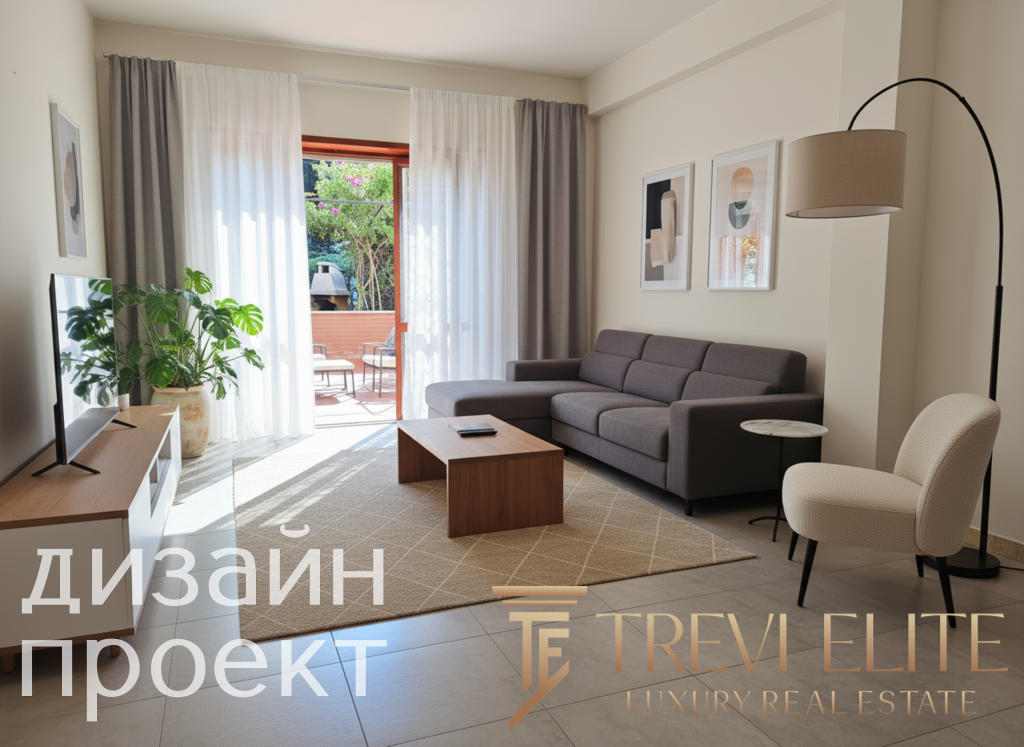 Современная гостиная с мягким серым диваном, декоративными картинами, светлыми шторами и частным балконом на заднем плане, создающая уютную атмосферу для комфортного проживания.